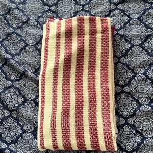 Red and cream colored large scarf shawl.